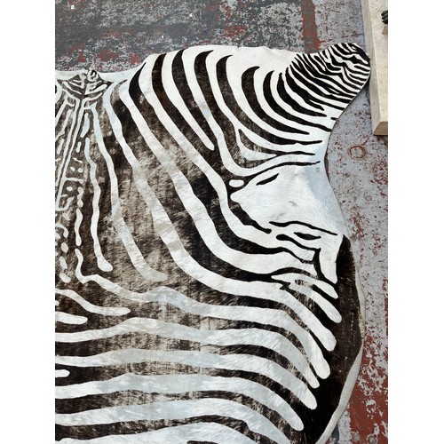 183 - A zebra hide rug - approx. 210cm x 212cm