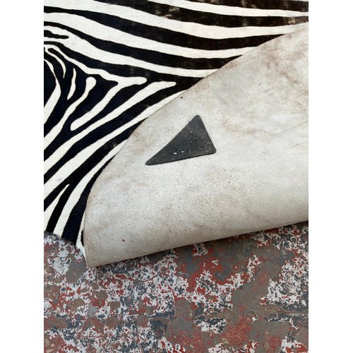 183 - A zebra hide rug - approx. 210cm x 212cm