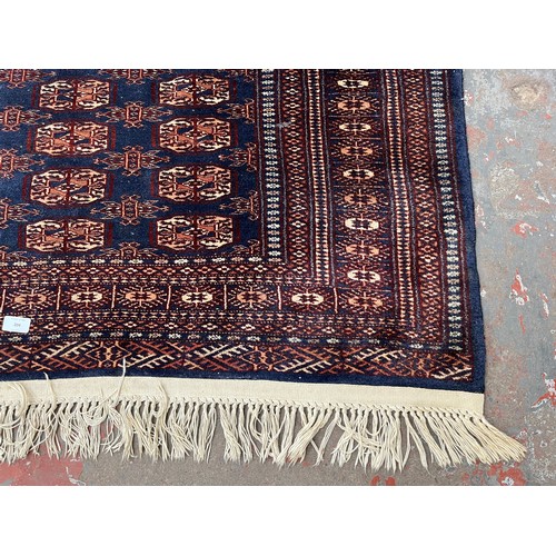 204 - A mid/late 20th century Bokhara blue rug - approx. 185cm x 126cm