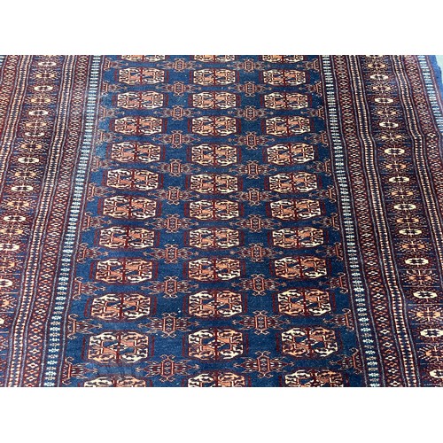 204 - A mid/late 20th century Bokhara blue rug - approx. 185cm x 126cm