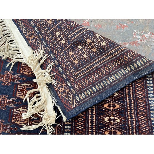 204 - A mid/late 20th century Bokhara blue rug - approx. 185cm x 126cm