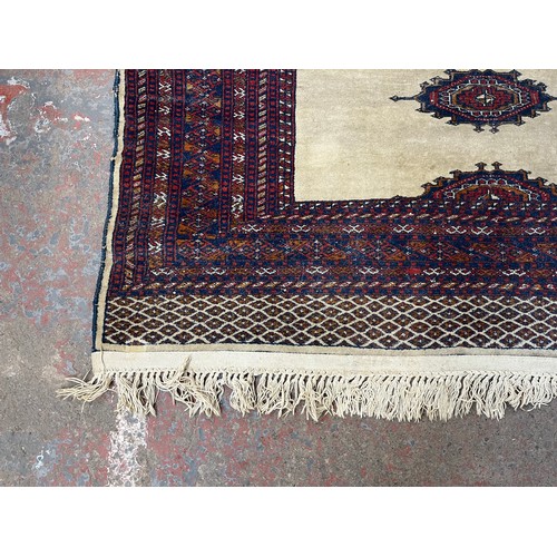 207 - A mid/late 20th century Persian machine woven rug - approx. 186cm x 140cm