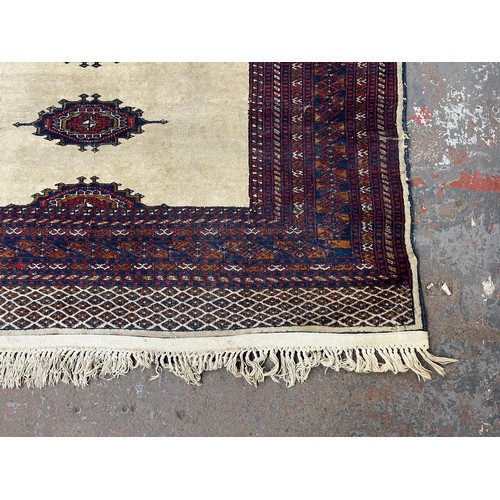 207 - A mid/late 20th century Persian machine woven rug - approx. 186cm x 140cm