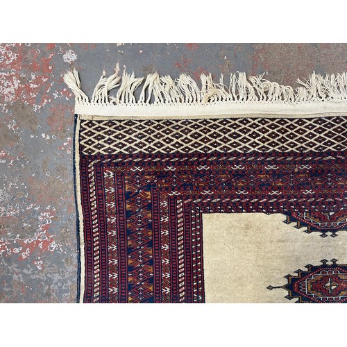 207 - A mid/late 20th century Persian machine woven rug - approx. 186cm x 140cm