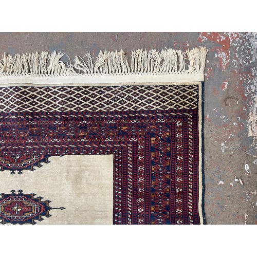 207 - A mid/late 20th century Persian machine woven rug - approx. 186cm x 140cm