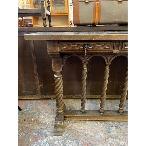 74 - A Gothic style carved hardwood console table with barley twist supports - approx. 75cm high x 100cm ... 