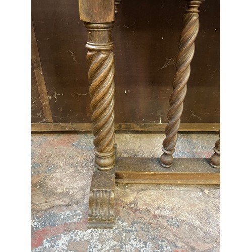 74 - A Gothic style carved hardwood console table with barley twist supports - approx. 75cm high x 100cm ... 