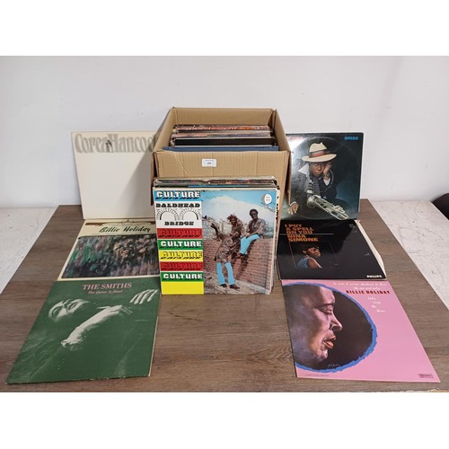 656 - A box containing a collection of LP and 12