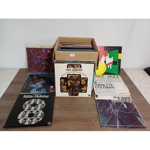 656 - A box containing a collection of LP and 12