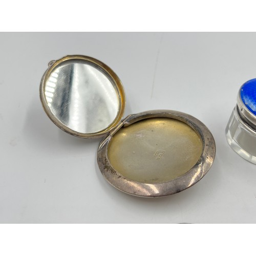 2164 - Four sterling silver items, one compact, one blue guilloche enamel lidded vanity jar, one mask hat p... 