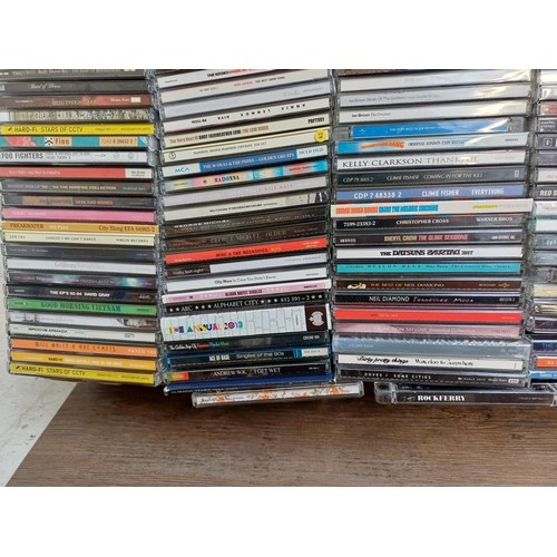 660 - Two boxes containing a large collection of CDs to include Finn, Foo Fighters, Cosmic Rough Riders, P... 