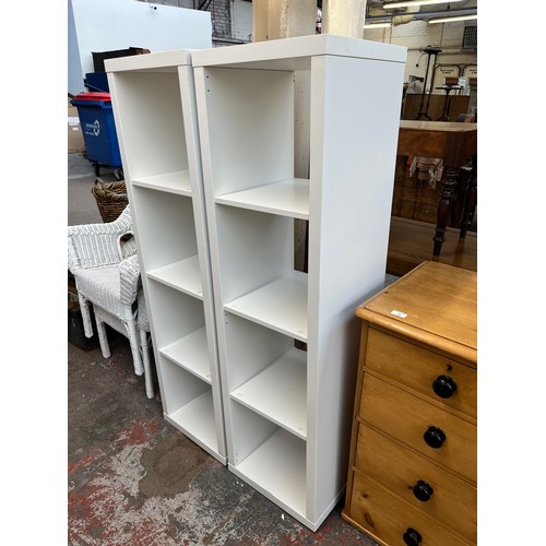 203 - A pair of IKEA Kallax white laminate shelving units - approx. 148cm high x 41cm wide x 39cm deep