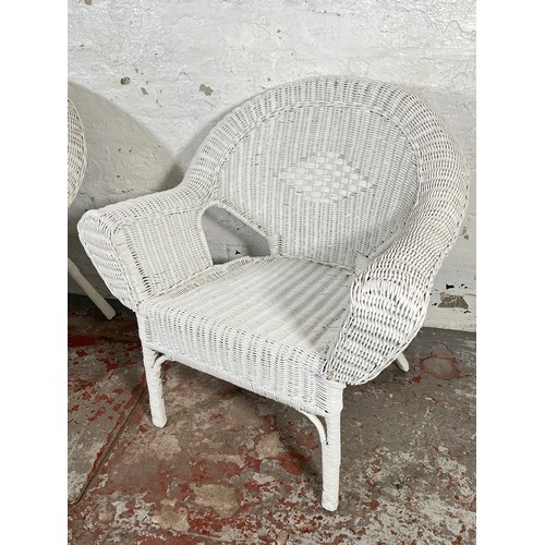 201 - A pair of white painted wicker armchairs