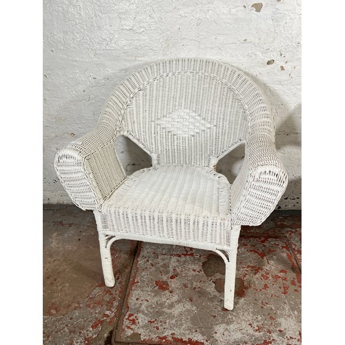 201 - A pair of white painted wicker armchairs