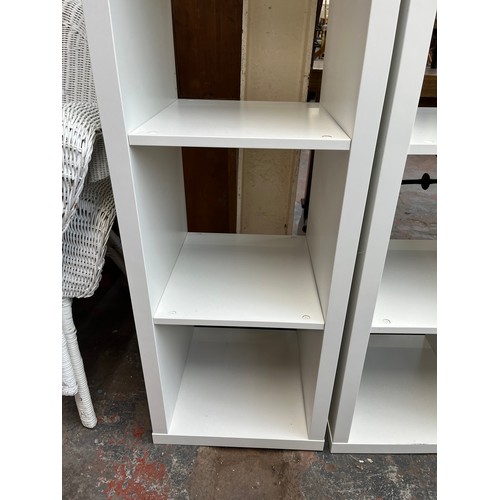 203 - A pair of IKEA Kallax white laminate shelving units - approx. 148cm high x 41cm wide x 39cm deep