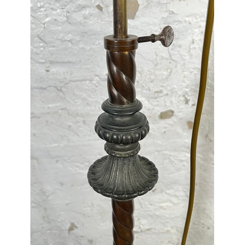 210 - A late 19th century copper and cast metal telescopic oil lamp with mottled glass reservoir and opaqu... 