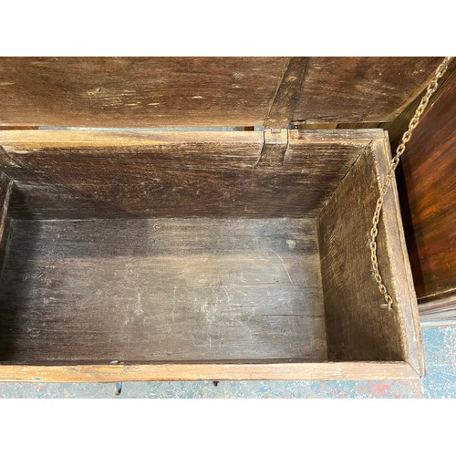 214 - A 19th century teak and metal banded marriage chest - approx. 57cm high x 104cm wide x 48cm deep