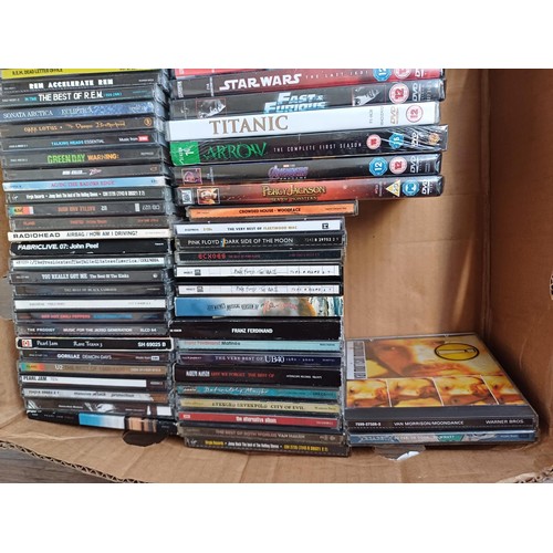 667 - A collection of sealed DVDs and unsealed CDs to include Pink Floyd, Oasis, Pearl Jam, The Prodigy, R... 