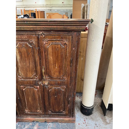 216 - An Indian sheesham wood two door cabinet - approx. 104cm high x 71cm wide x 37cm deep