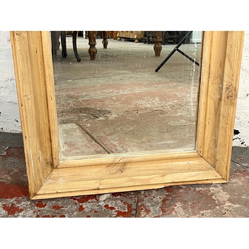 217 - A distressed pine framed wall mirror - approx. 116cm high x 46cm wide