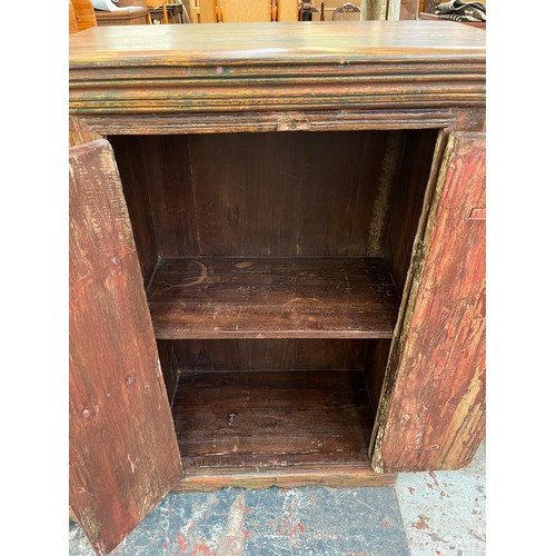 216 - An Indian sheesham wood two door cabinet - approx. 104cm high x 71cm wide x 37cm deep