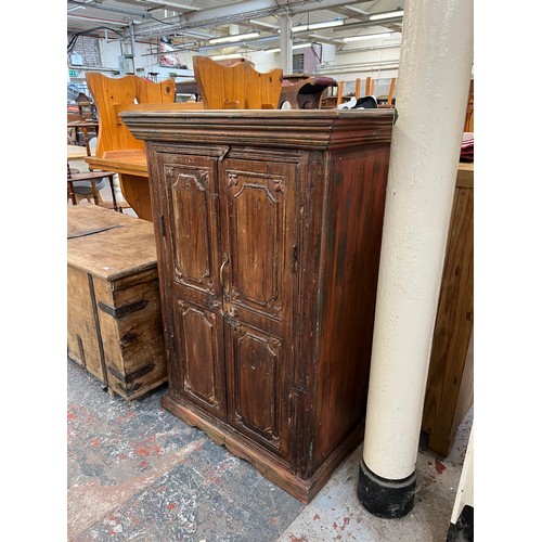 216 - An Indian sheesham wood two door cabinet - approx. 104cm high x 71cm wide x 37cm deep