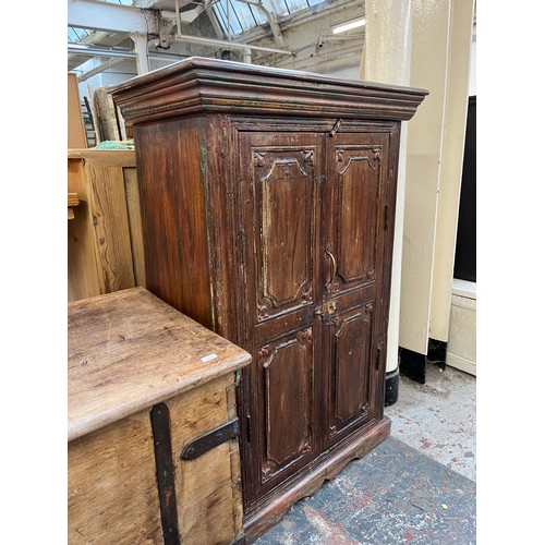 216 - An Indian sheesham wood two door cabinet - approx. 104cm high x 71cm wide x 37cm deep