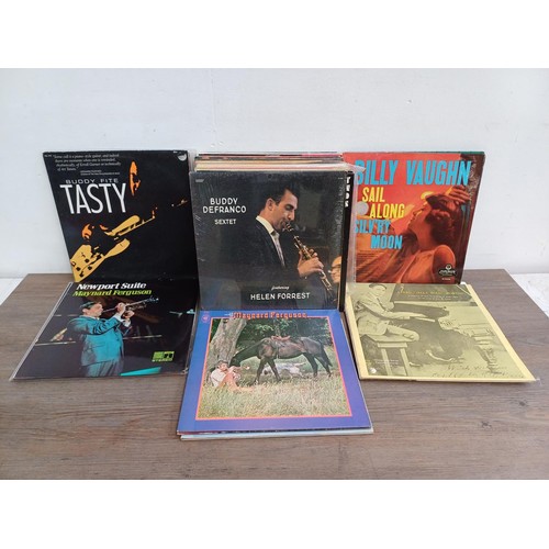 664 - A collection of jazz LP vinyl records to include Dizzy Gillespie, Charlie Parker, Maynard Ferguson, ... 