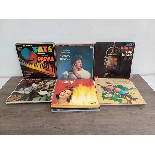 664 - A collection of jazz LP vinyl records to include Dizzy Gillespie, Charlie Parker, Maynard Ferguson, ... 