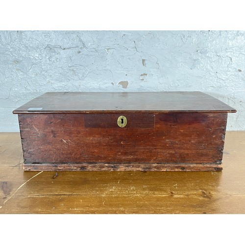 215 - A 19th century stained pine box with brass escutcheon and handles - approx. 20cm high x 64cm wide x ... 