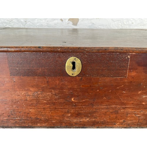 215 - A 19th century stained pine box with brass escutcheon and handles - approx. 20cm high x 64cm wide x ... 