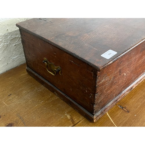 215 - A 19th century stained pine box with brass escutcheon and handles - approx. 20cm high x 64cm wide x ... 