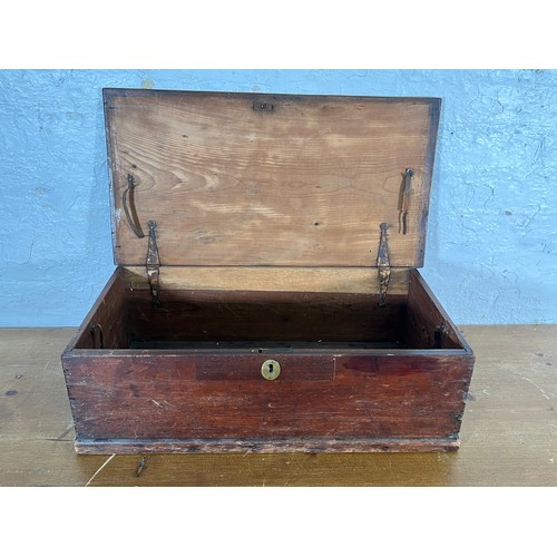 215 - A 19th century stained pine box with brass escutcheon and handles - approx. 20cm high x 64cm wide x ... 