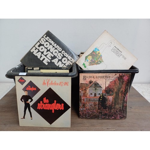 655A - Two boxes containing a large collection of vinyl records to include Black Sabbath, The Stranglers, J... 