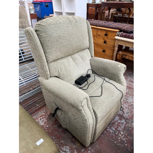 224 - A HSL Burrows Relax Grande green fabric electric dual rise and recline armchair with remote and powe... 