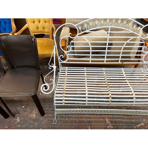 227 - A wrought metal two seater garden bench - approx. 97cm high x 120cm wide x 55cm deep