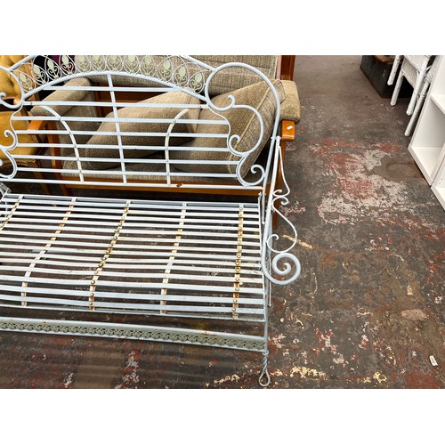 227 - A wrought metal two seater garden bench - approx. 97cm high x 120cm wide x 55cm deep