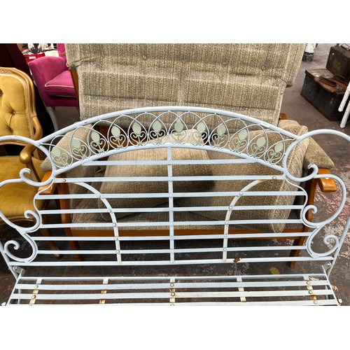 227 - A wrought metal two seater garden bench - approx. 97cm high x 120cm wide x 55cm deep