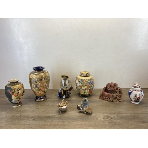 392 - Eight Oriental items to include Two Japanese Satsuma porcelain vases - largest approx. 26cm high, Ja... 