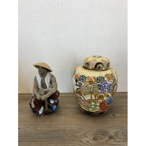 392 - Eight Oriental items to include Two Japanese Satsuma porcelain vases - largest approx. 26cm high, Ja... 