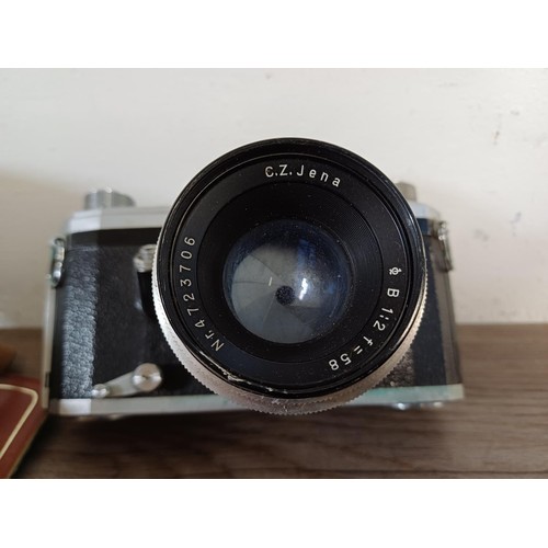 678 - Two cased Zeiss Ikon items, one mid 20th century Pentacon (export branding) Zeiss Ikon Contax D 35mm... 