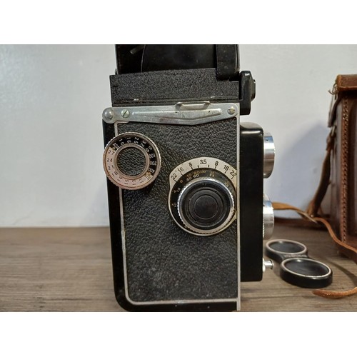 679 - A cased Yashica-A 6 x 6 medium format TLR camera fitted with Yashikor 1:3.5 f=80mm lenses and Copal ... 