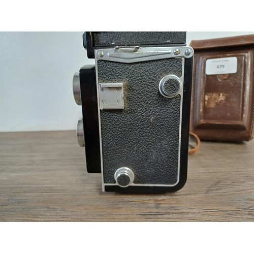 679 - A cased Yashica-A 6 x 6 medium format TLR camera fitted with Yashikor 1:3.5 f=80mm lenses and Copal ... 