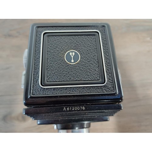 679 - A cased Yashica-A 6 x 6 medium format TLR camera fitted with Yashikor 1:3.5 f=80mm lenses and Copal ... 