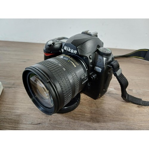 682 - A cased Nikon D70 digital camera fitted with Nikon DX AF-S Nikkor 18-70mm 1:3.5-4.5G ED lens with ca... 