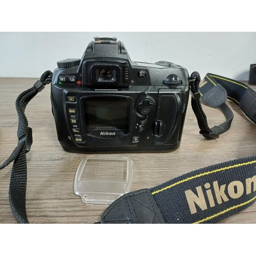 682 - A cased Nikon D70 digital camera fitted with Nikon DX AF-S Nikkor 18-70mm 1:3.5-4.5G ED lens with ca... 