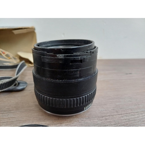 696 - Six items to include Pentacon Praktica Super TL1000 35mm SLR camera fitted with 1.8/50 lens, Canon E... 