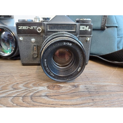 693 - A collection of cameras to include Zenit EM 35mm SLR fitted with Helios-44M 2/58 lens, cased Minolta... 