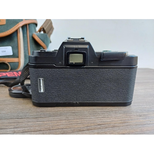 694 - A Miranda camera bag containing Pentax P30 35mm SLR fitted with Sigma super-wide II 1:2.8 f=24mm len... 