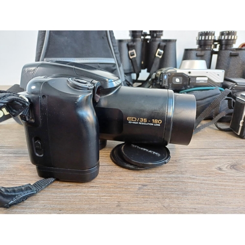 698 - A collection of cameras and binoculars to include cased Olympus iS-3000 35mm bridge camera, Canon AF... 